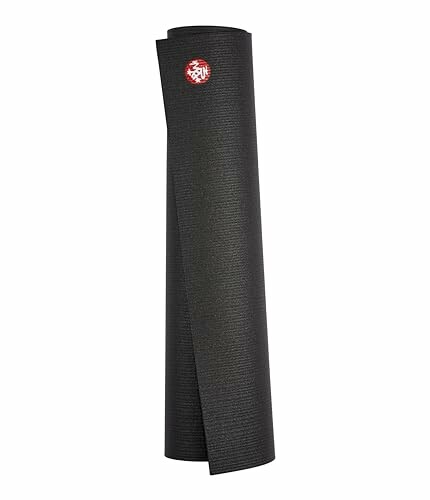 Rolled black yoga mat with a red logo