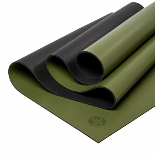 Green and black yoga mat rolled out